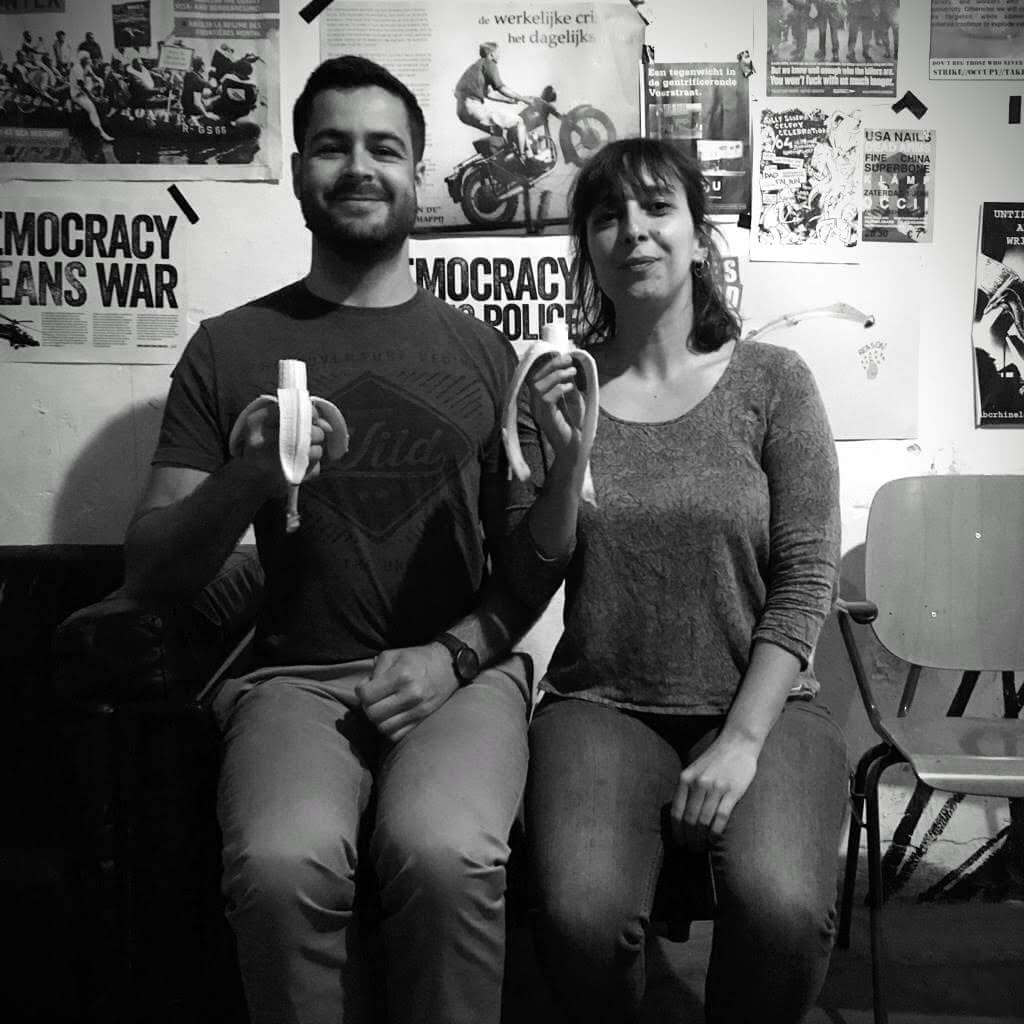 Santiago and Joana eating banana before S.H.I.T. Show (black/white picture).